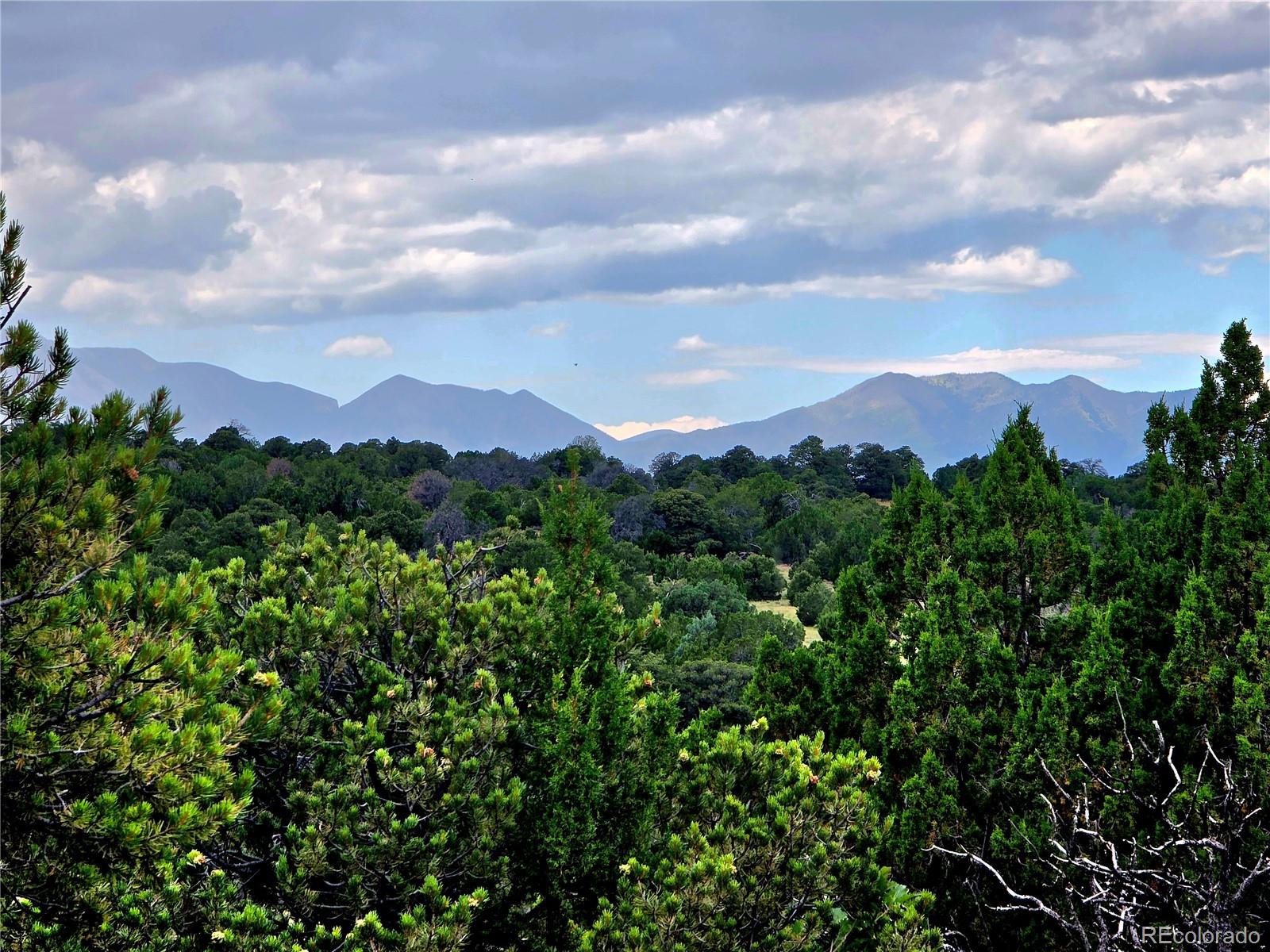 Lot 97-phase Lot 97-phase Ranch Walsenburg, CO 81089 - Photo 2 of 20 a view of a city with lush green forest