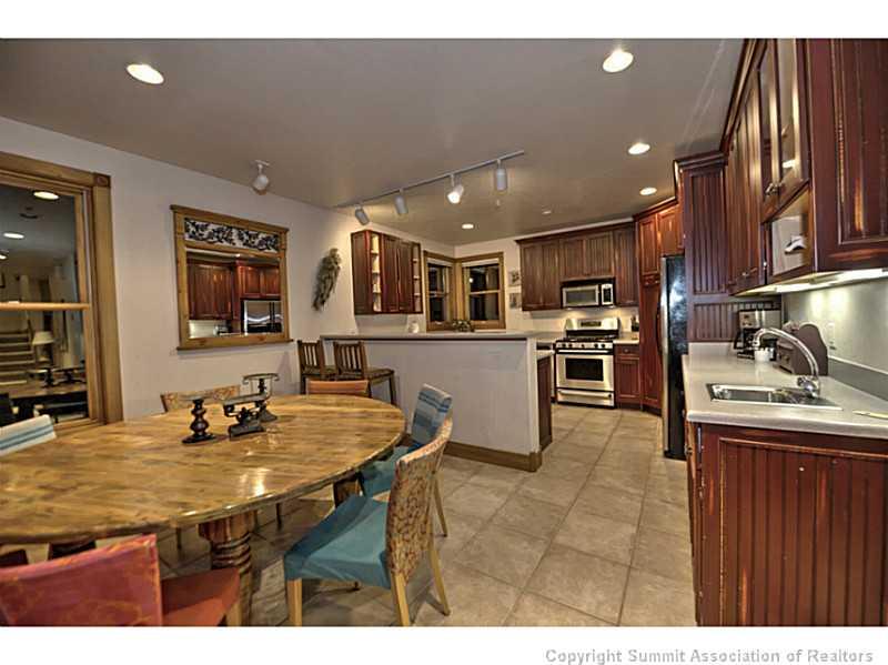 70 River Run Road, Unit 202 Keystone, CO 80435 - Photo 1 of 19 a kitchen with stainless steel appliances granite countertop a sink refrigerator and cabinets