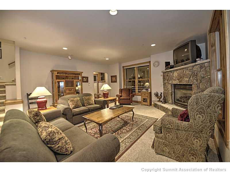 70 River Run Road, Unit 202 Keystone, CO 80435 - Photo 3 of 19 a living room with fireplace furniture and a flat screen tv