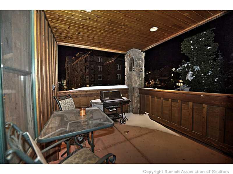 70 River Run Road, Unit 202 Keystone, CO 80435 - Photo 5 of 19 a view of a deck with wooden floor and a garden