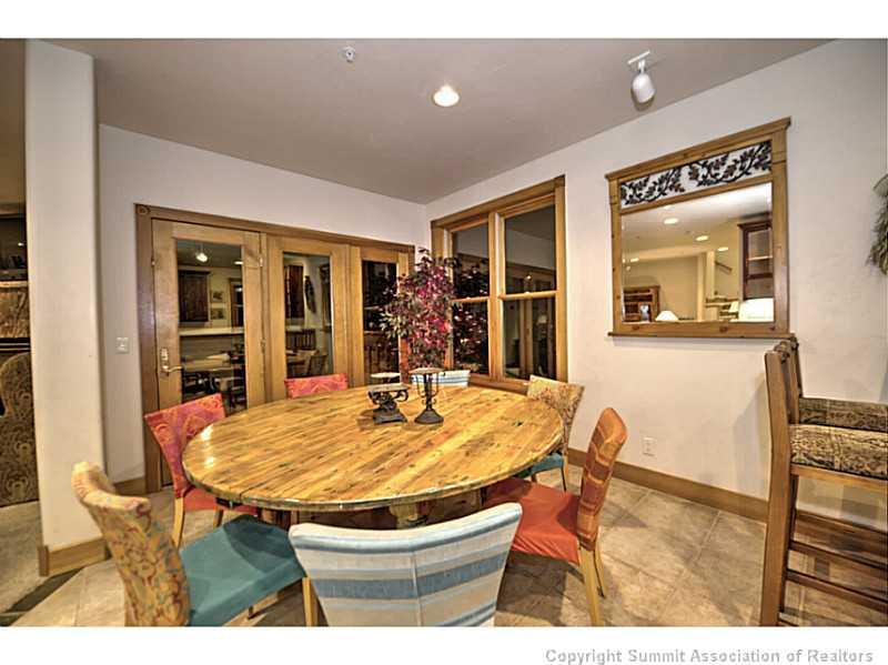 70 River Run Road, Unit 202 Keystone, CO 80435 - Photo 7 of 19 a dining room with a table and chairs