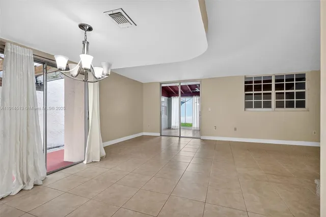 a view of an empty room with stairs