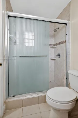 a view of a chair and table in backyard of the house