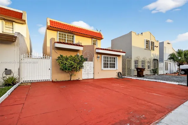a view of a house with a street