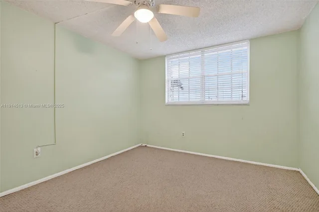 a front view of a house with a yard table and chairs