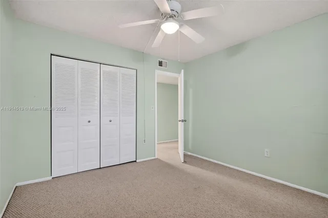 an aerial view of multiple house with a yard