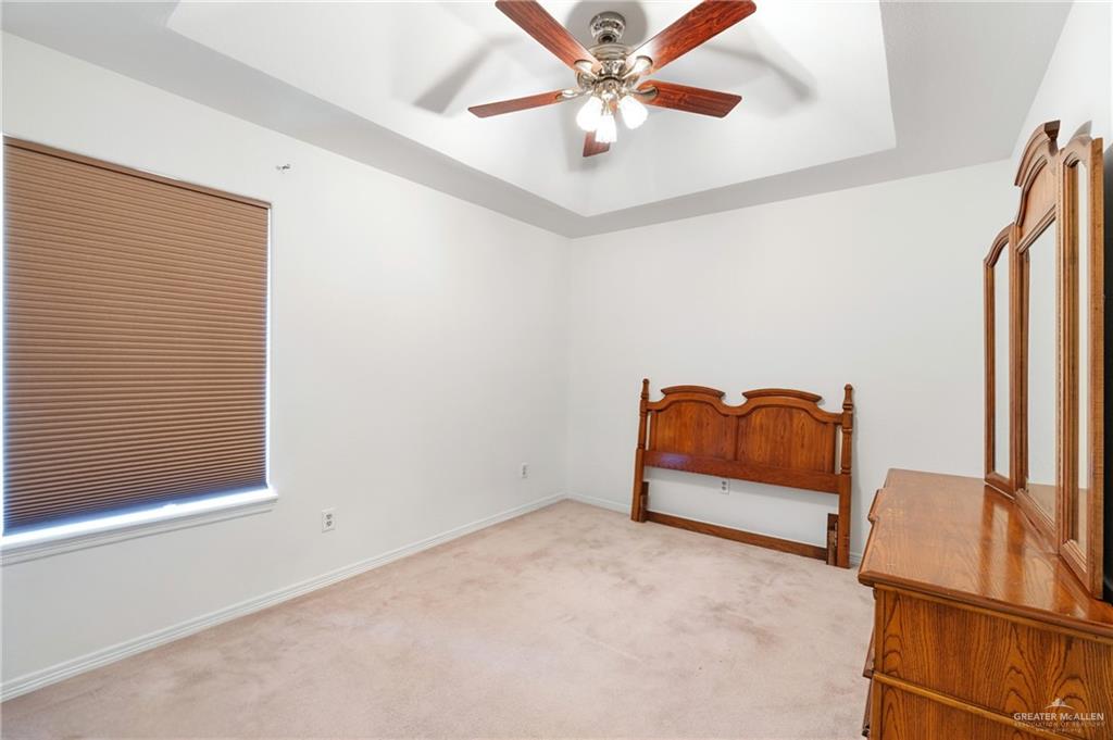 4822 East Canton Road Edinburg, TX 78542 - Photo 11 of 28 a bedroom with furniture and a window