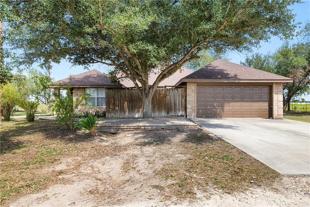 4822 East Canton Road Edinburg, TX 78542 - Photo 28 of 28 a front view of a house with a garden