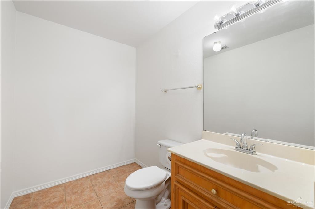 4822 East Canton Road Edinburg, TX 78542 - Photo 10 of 28 a bathroom with a sink and a toilet