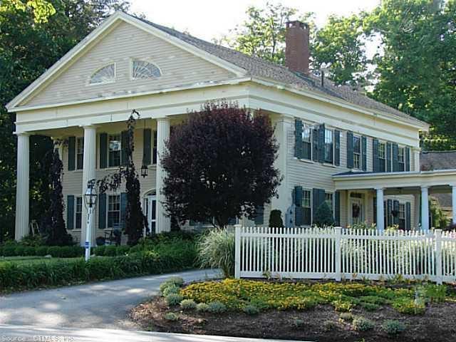 374 Thompson Road Thompson, CT 06277 - Photo 1 of 1 a front view of a house with a garden