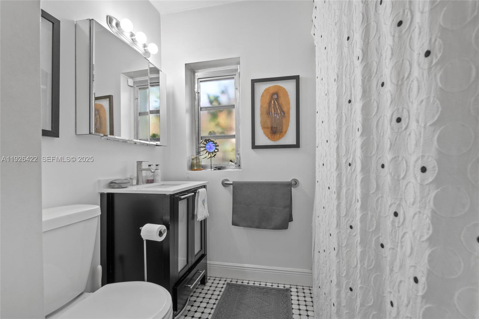 2460 Southwest 24th Street Miami, FL 33145 - Photo 19 of 36 a bathroom with a toilet sink shower and mirror