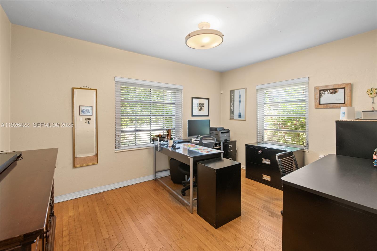 2460 Southwest 24th Street Miami, FL 33145 - Photo 20 of 36 a view of a workspace with furniture and a window