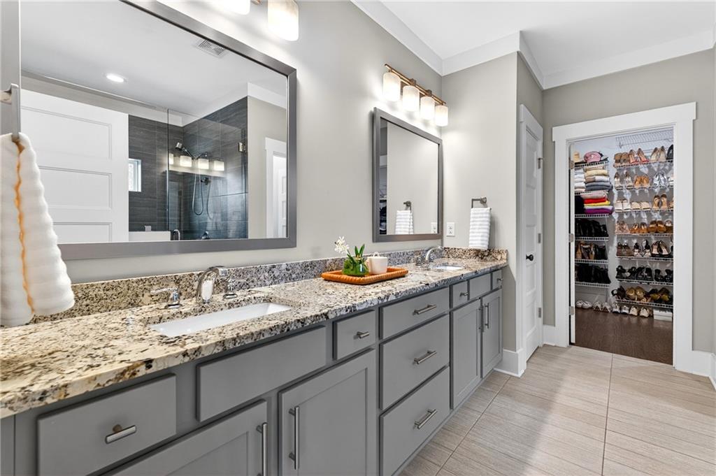 4072 Comanche Drive Tucker, GA 30084 - Photo 26 of 43 a bathroom with a granite countertop sink double vanity and a mirror