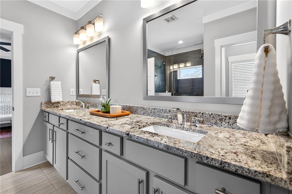 4072 Comanche Drive Tucker, GA 30084 - Photo 28 of 43 a bathroom with double sink and a mirror
