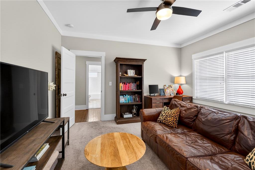 4072 Comanche Drive Tucker, GA 30084 - Photo 30 of 43 a living room with furniture and a flat screen tv