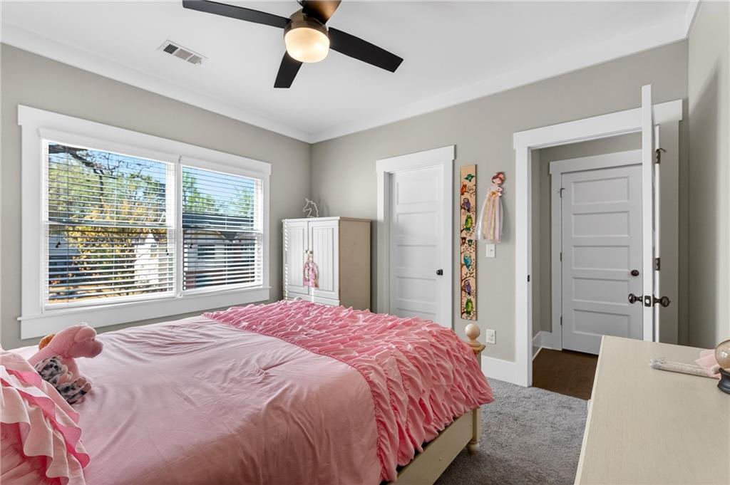 4072 Comanche Drive Tucker, GA 30084 - Photo 32 of 43 a bedroom with a large bed and a chandelier