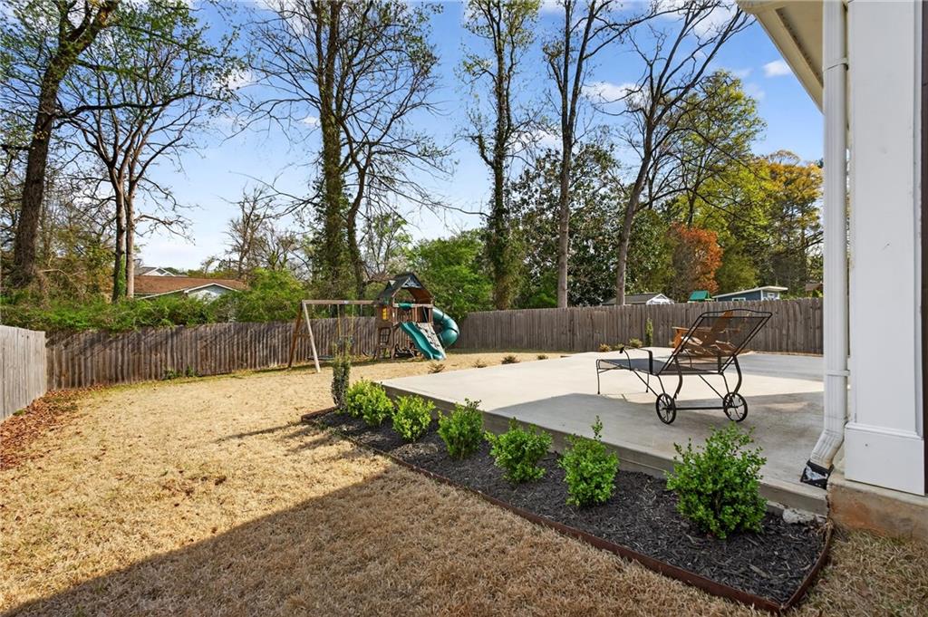 4072 Comanche Drive Tucker, GA 30084 - Photo 40 of 43 a view of a backyard with a bench