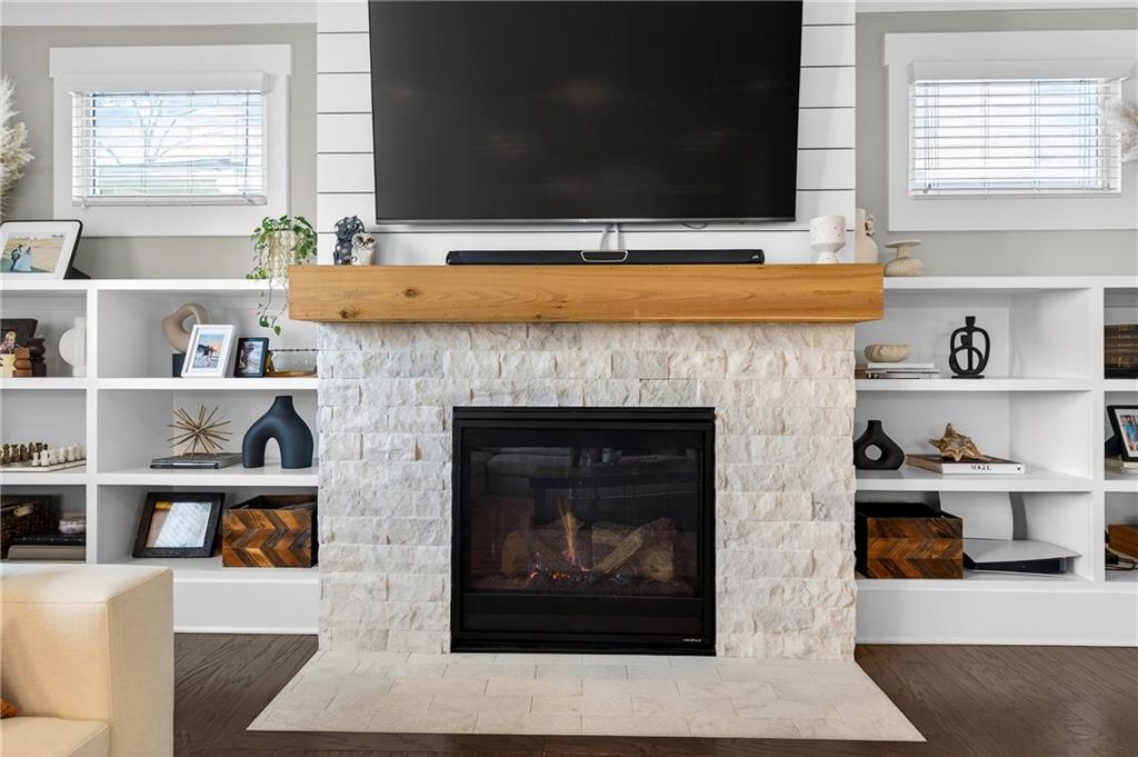 4072 Comanche Drive Tucker, GA 30084 - Photo 10 of 43 a living room with a fireplace and a flat screen tv