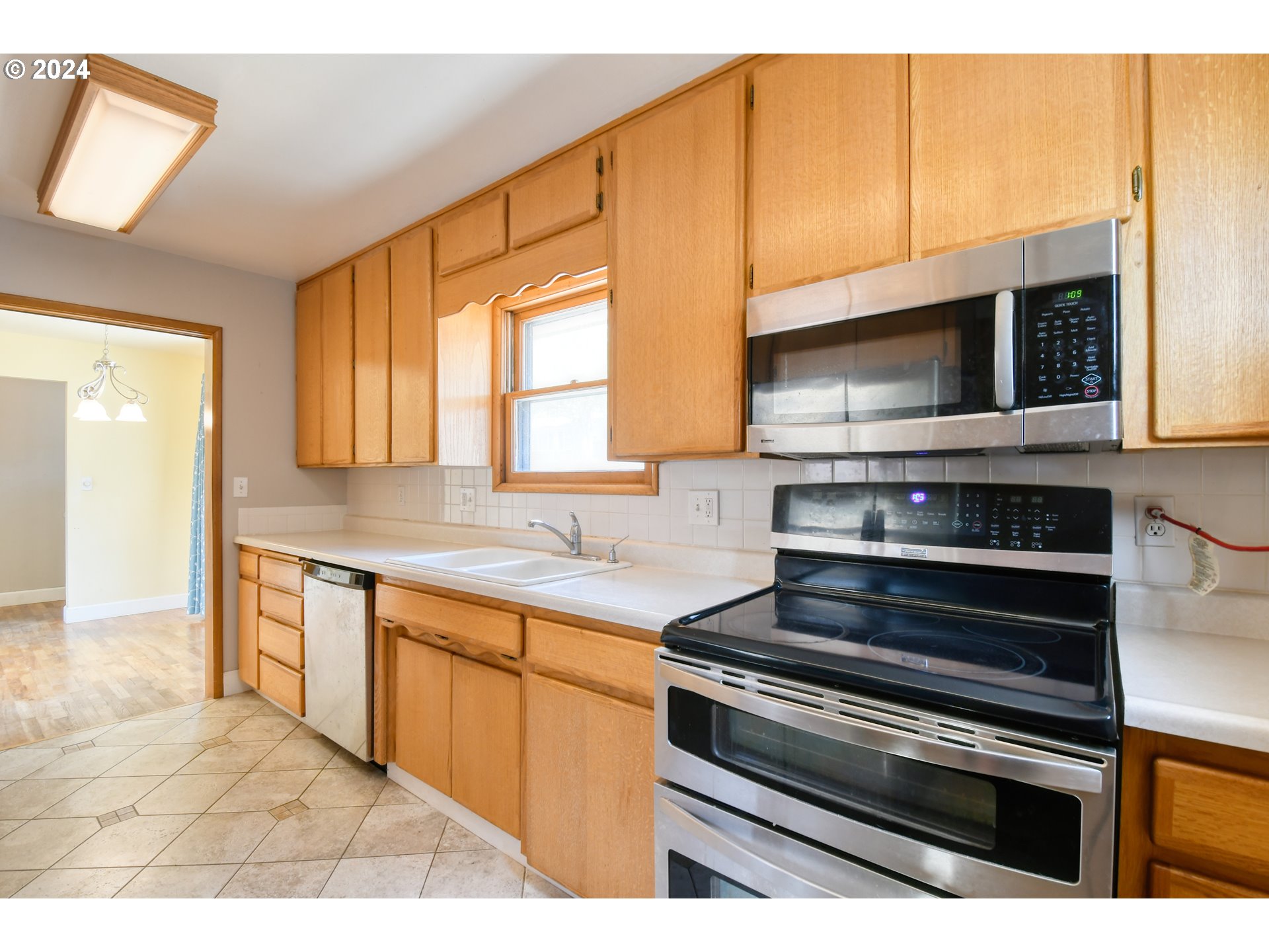 823 Northwest 5th Street Pendleton, OR 97801 - Photo 12 of 34 a kitchen with a stove and a microwave