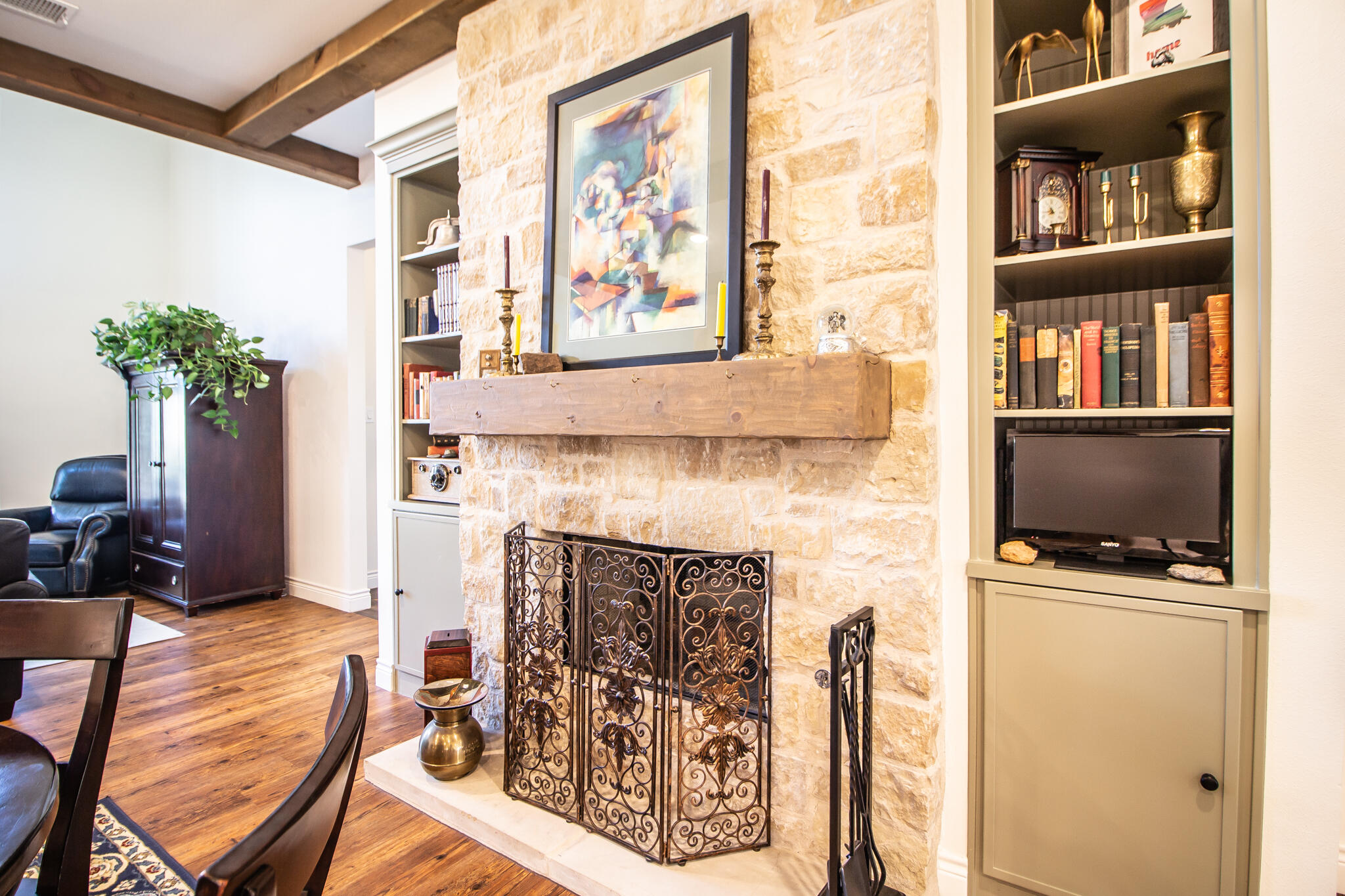 4019 137th Street Lubbock, TX 79423 - Photo 12 of 46 a living room with furniture a flat screen tv and a fireplace