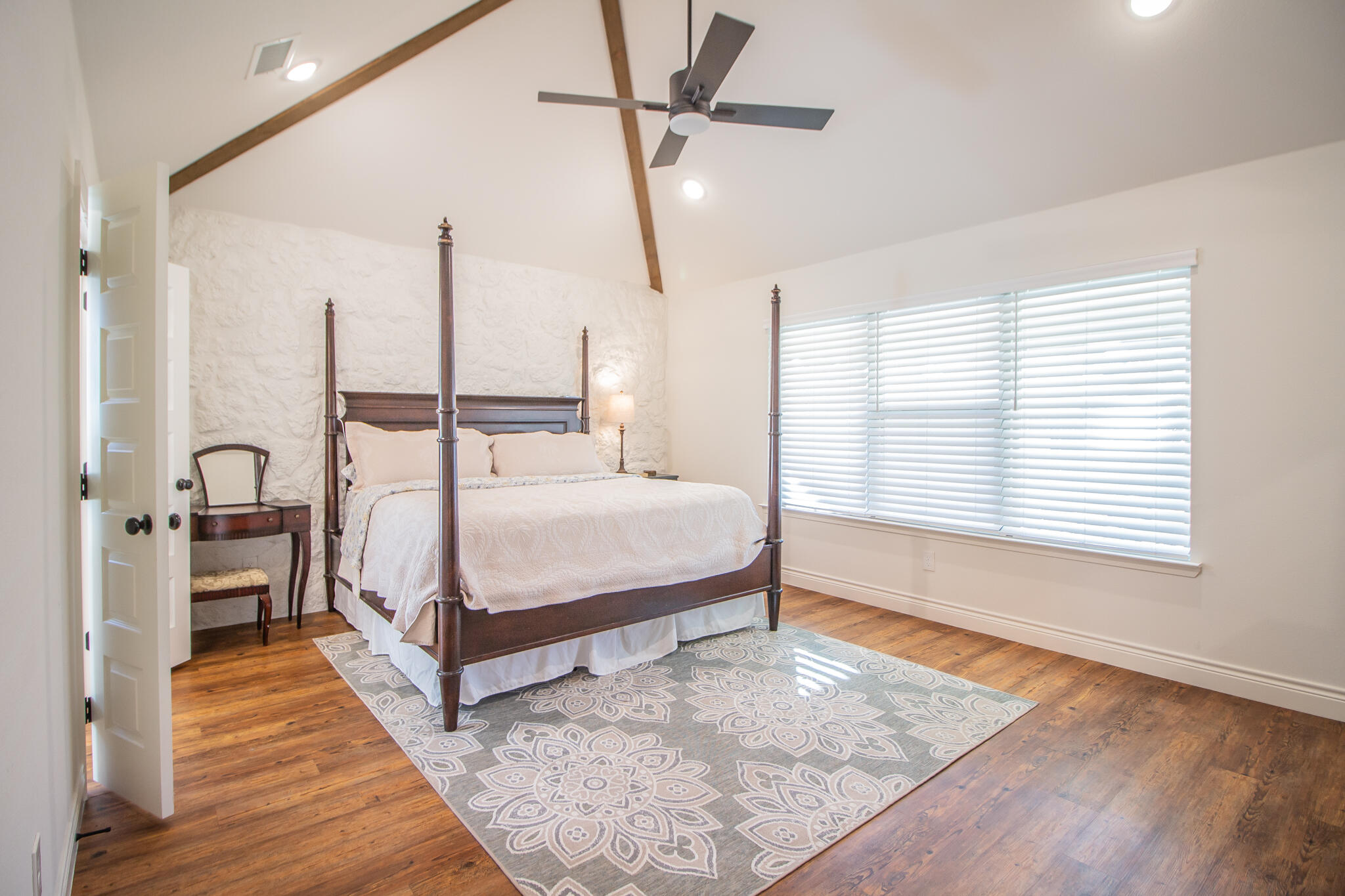 4019 137th Street Lubbock, TX 79423 - Photo 25 of 46 a bedroom with a bed a dresser and window
