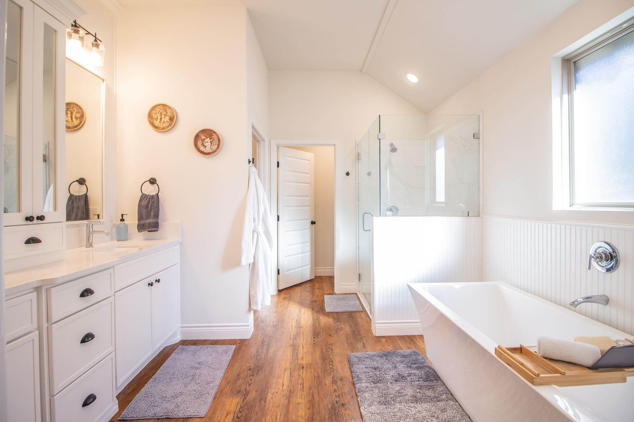 4019 137th Street Lubbock, TX 79423 - Photo 26 of 46 a bathroom with a tub sink and a mirror