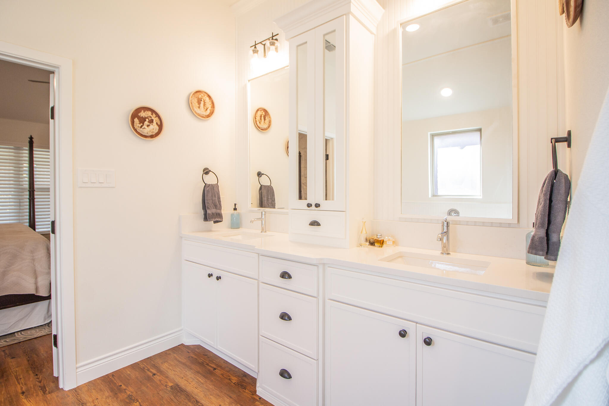 4019 137th Street Lubbock, TX 79423 - Photo 28 of 46 a bathroom with a sink and a mirror
