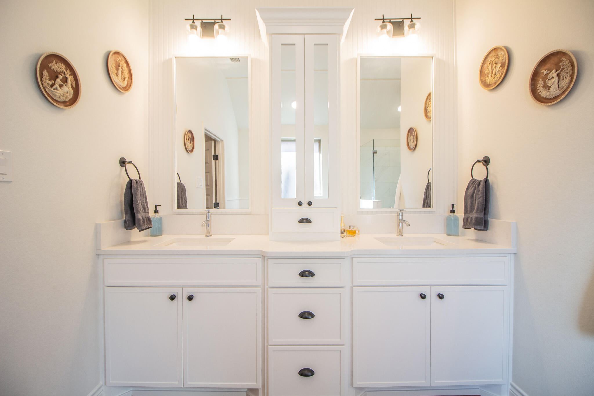 4019 137th Street Lubbock, TX 79423 - Photo 29 of 46 a bathroom with a sink and a mirror