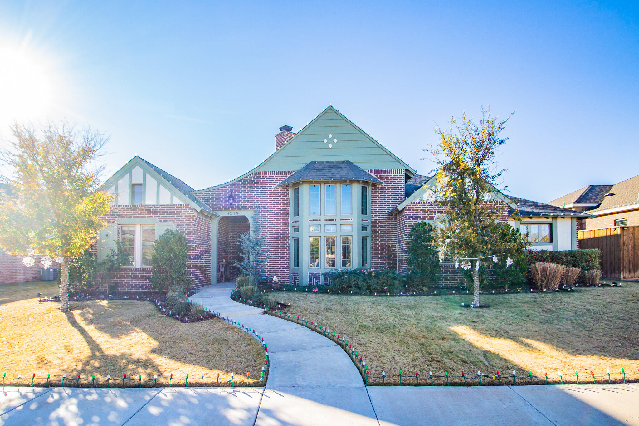 4019 137th Street Lubbock, TX 79423 - Photo 3 of 46 a front view of a house with garden