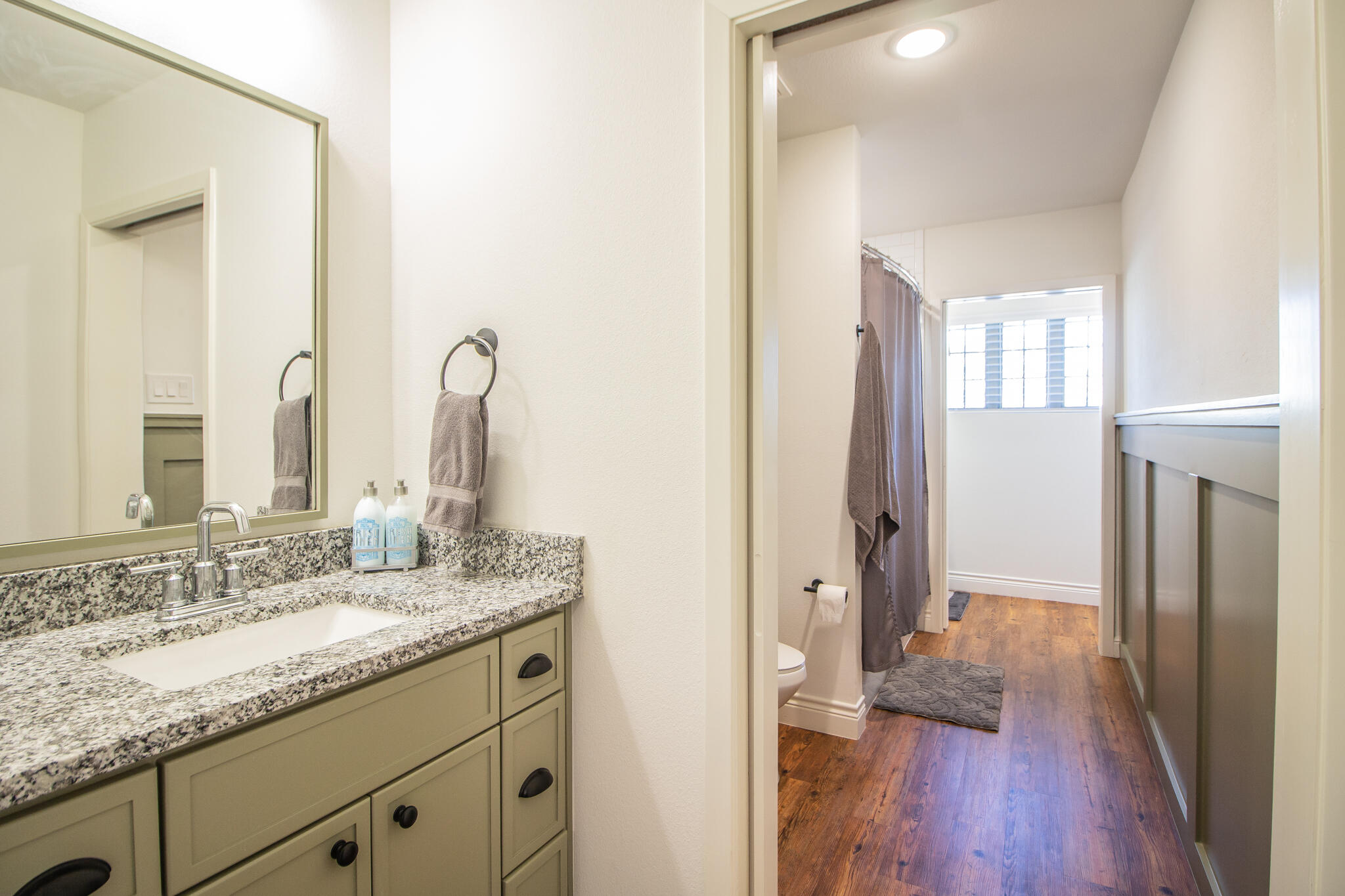 4019 137th Street Lubbock, TX 79423 - Photo 37 of 46 a bathroom with a granite countertop sink and a mirror