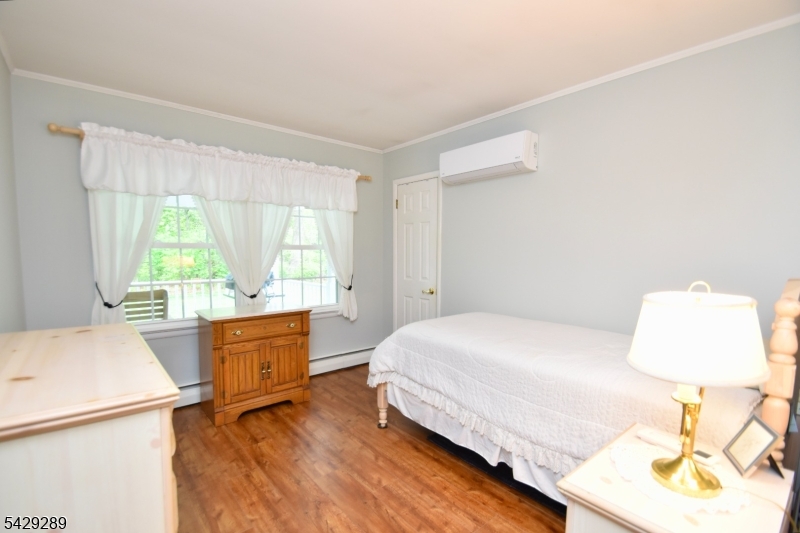 16 Pequot Trail Oak Ridge, NJ 07438 - Photo 8 of 18 a bedroom with a bed and a window