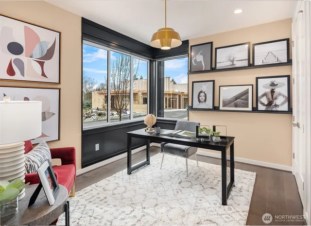 a living room with furniture a rug and a window