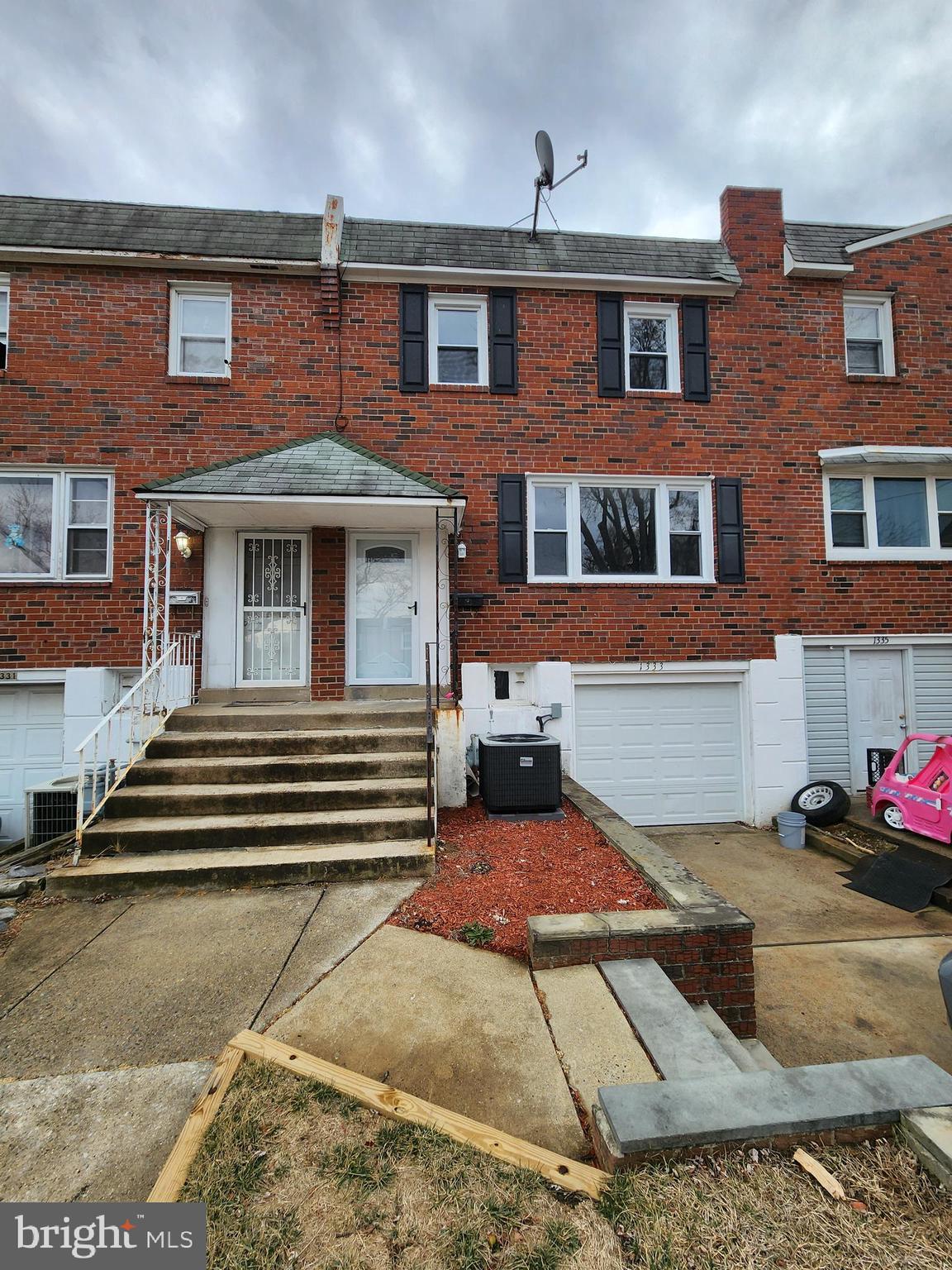 1333 Adair Road Brookhaven, PA 19015 - Photo 1 of 16 a front view of a house with a yard