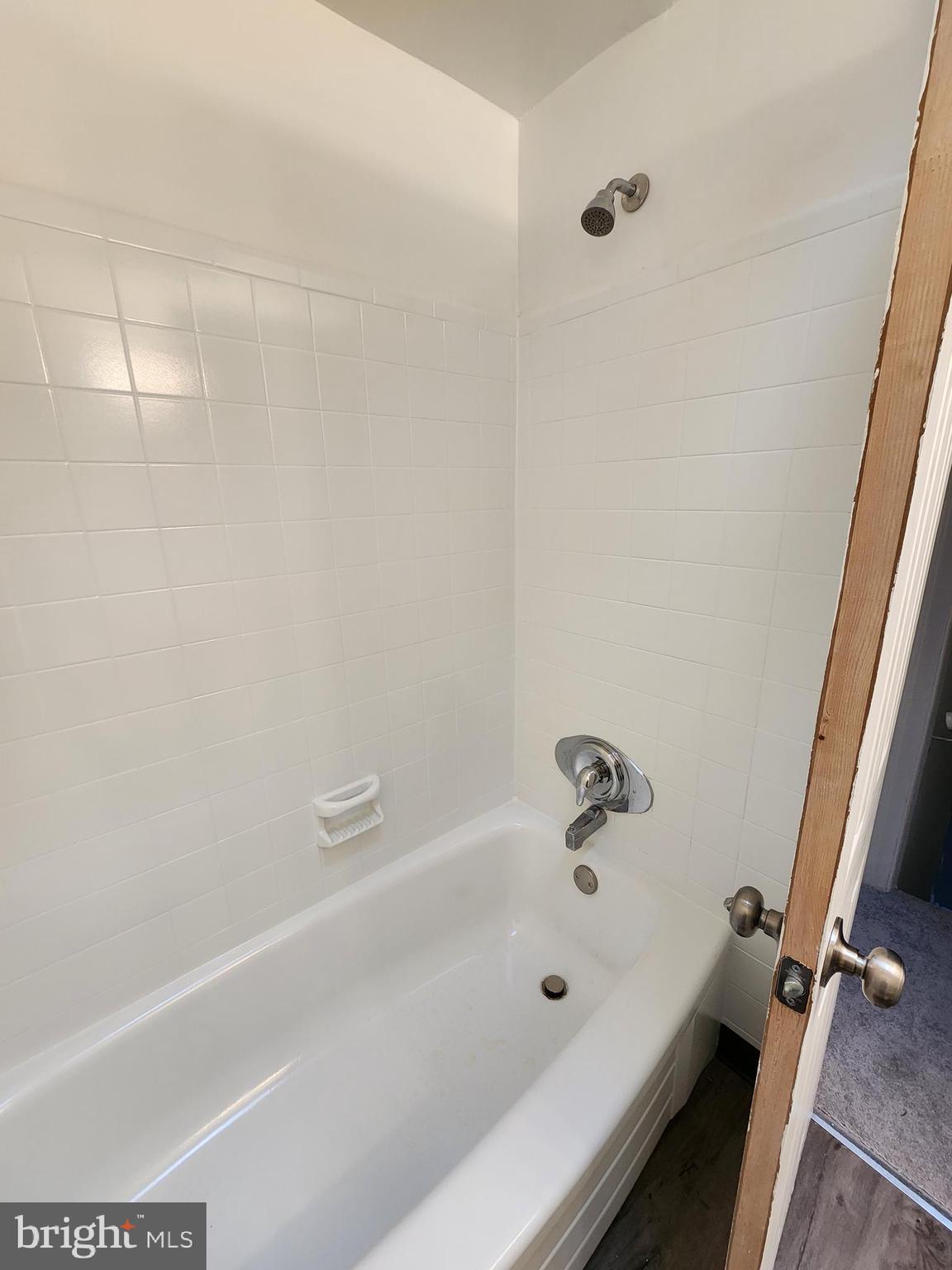 1333 Adair Road Brookhaven, PA 19015 - Photo 12 of 16 a bathroom with a bathtub