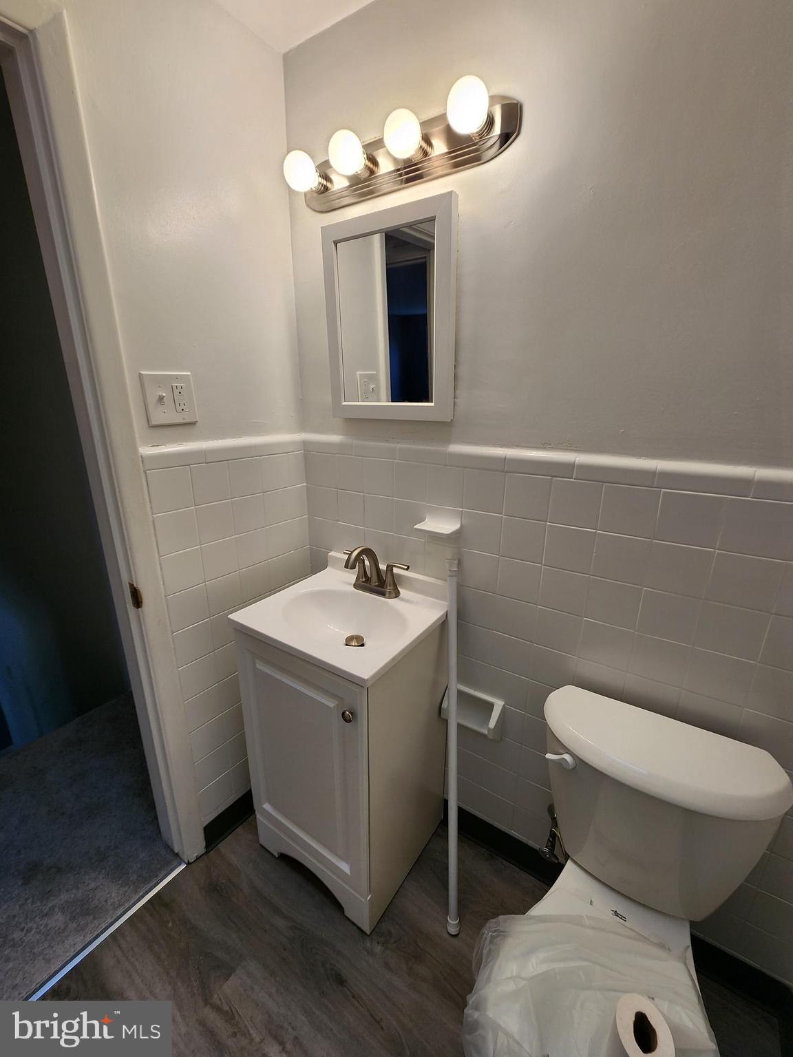1333 Adair Road Brookhaven, PA 19015 - Photo 13 of 16 a bathroom with a sink toilet and mirror