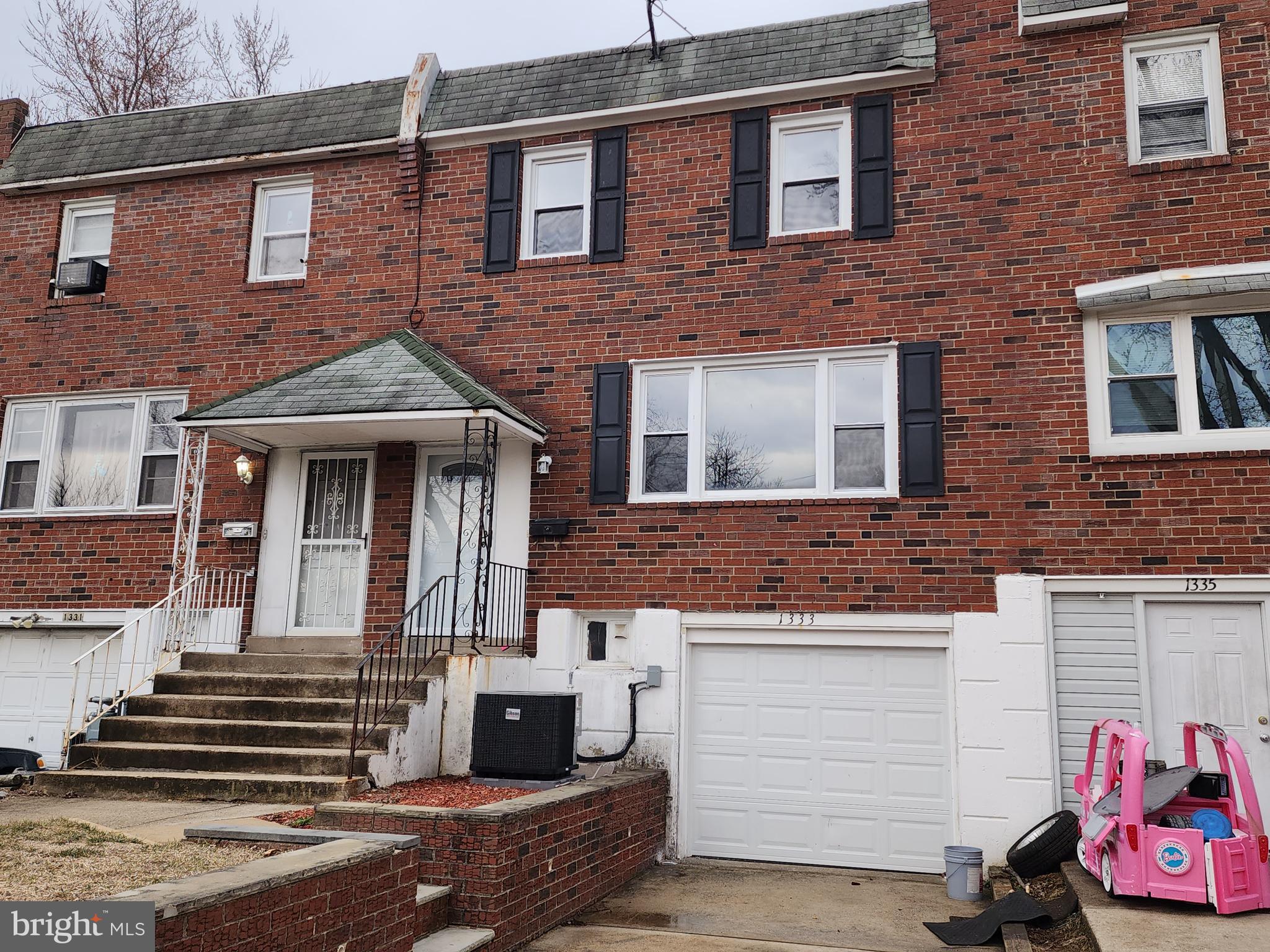 1333 Adair Road Brookhaven, PA 19015 - Photo 16 of 16 a front view of a house with a garage