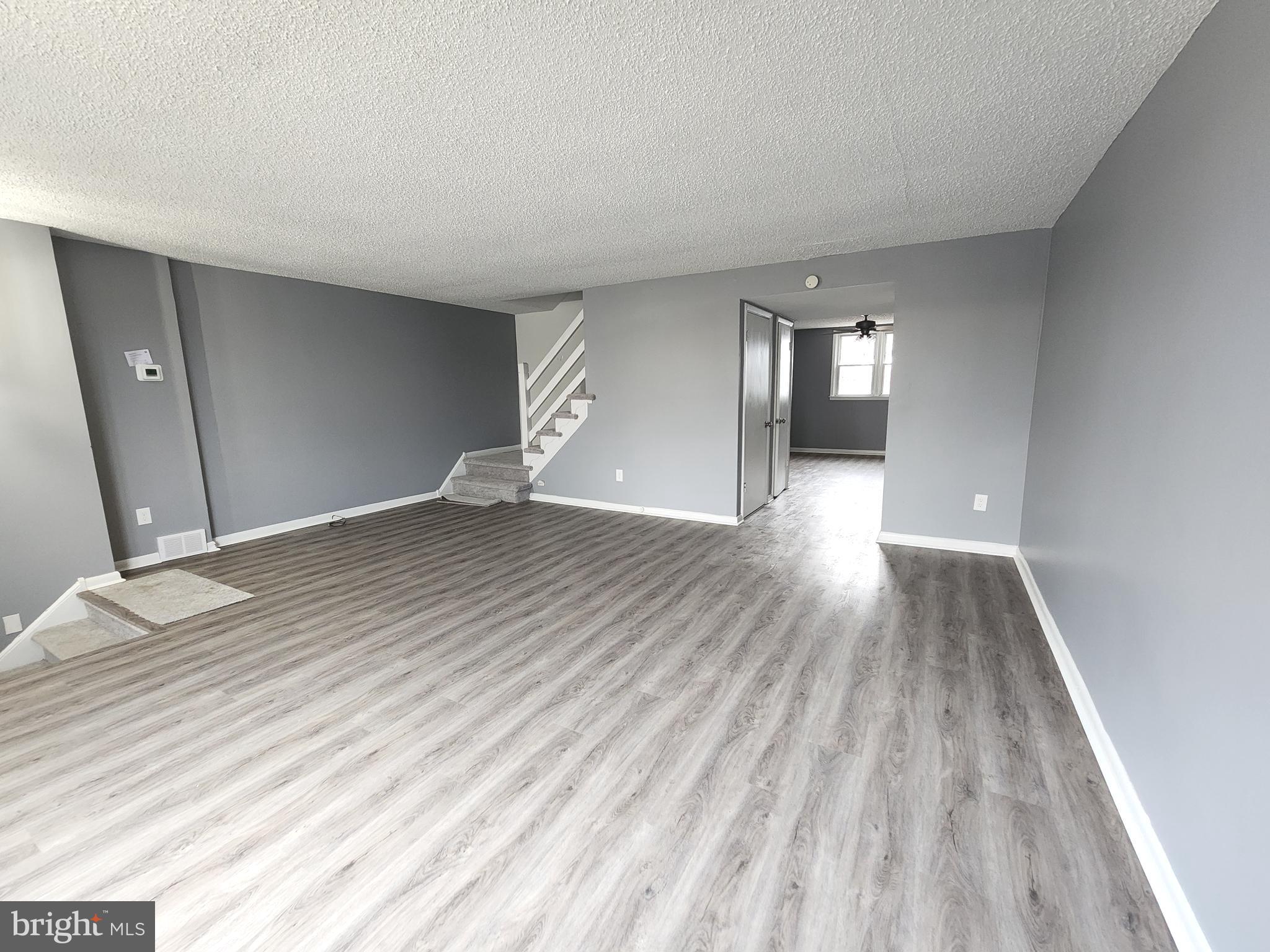 1333 Adair Road Brookhaven, PA 19015 - Photo 2 of 16 wooden floor in a hall with an entryway