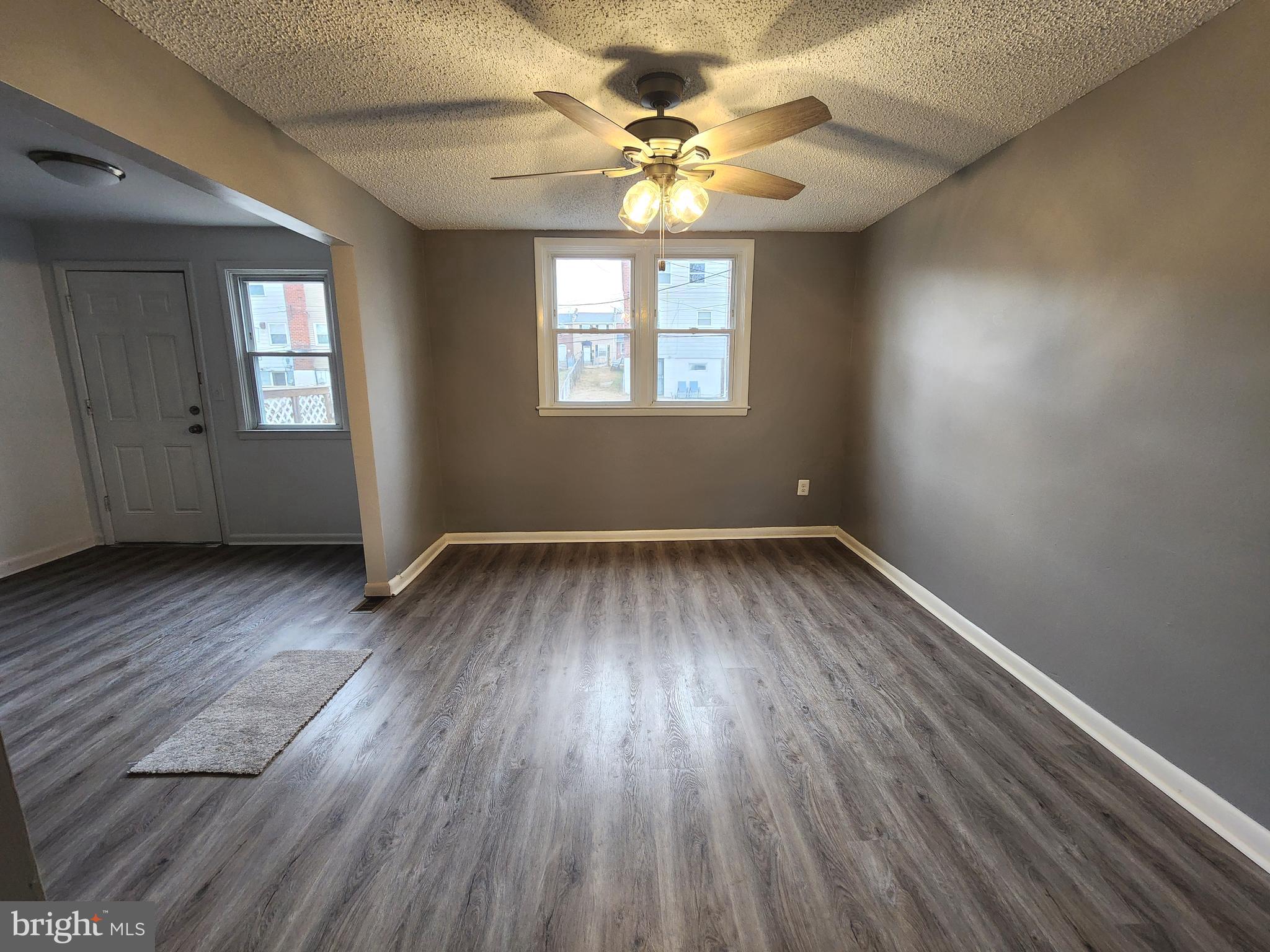 1333 Adair Road Brookhaven, PA 19015 - Photo 4 of 16 an empty room with wooden floor and windows