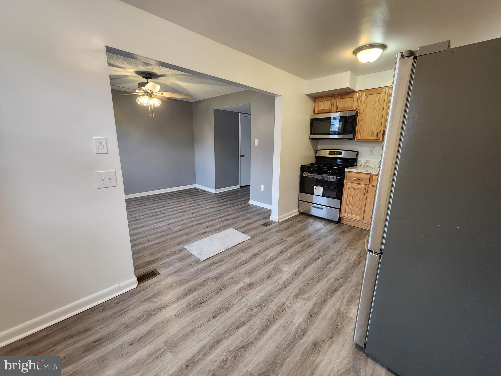 1333 Adair Road Brookhaven, PA 19015 - Photo 5 of 16 a view of a kitchen with a refrigerator a stove top oven