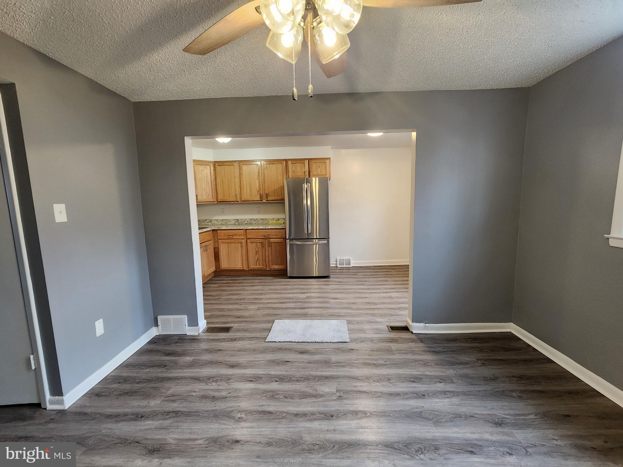 1333 Adair Road Brookhaven, PA 19015 - Photo 6 of 16 a view of empty room with wooden floor