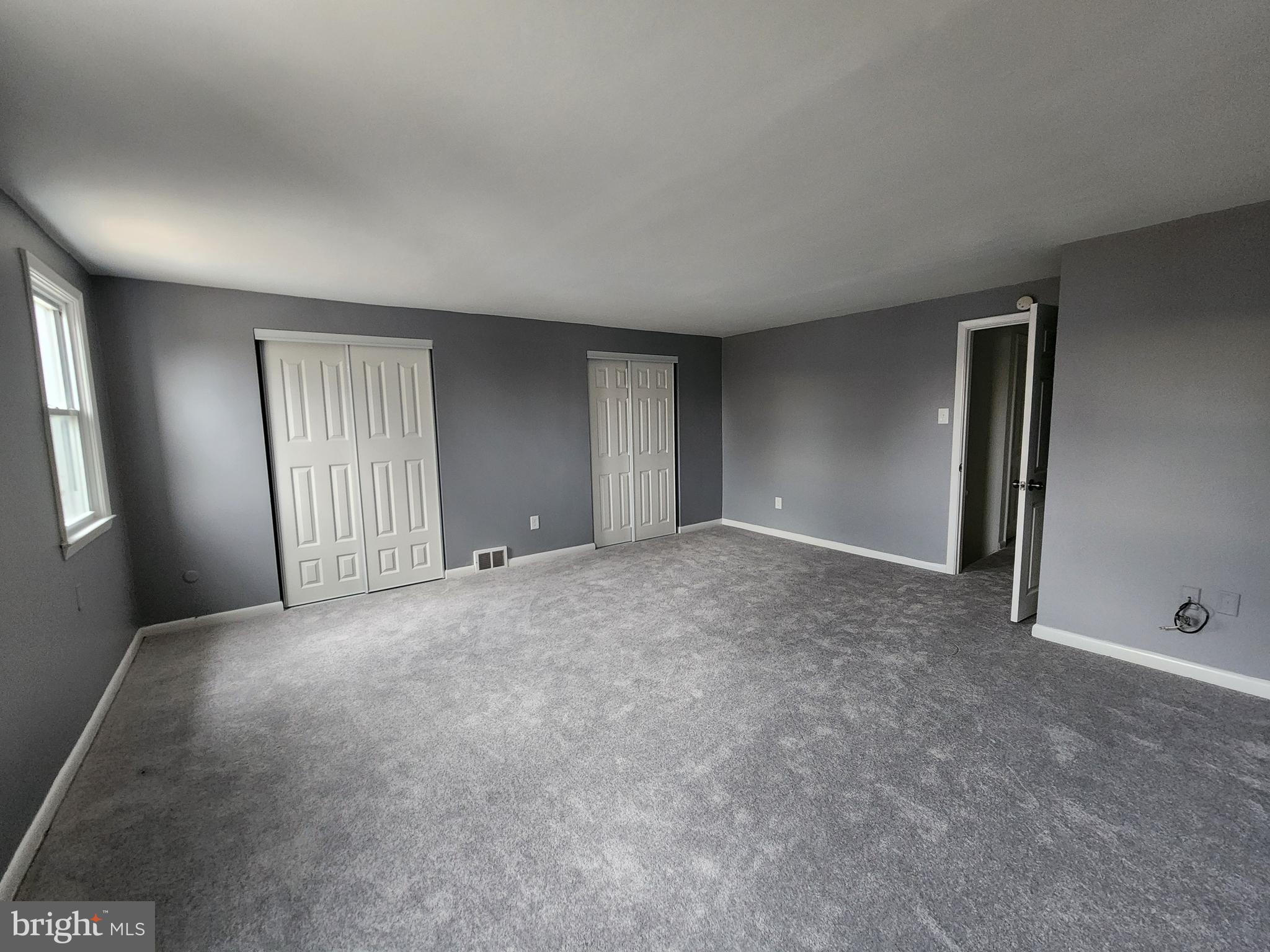 1333 Adair Road Brookhaven, PA 19015 - Photo 8 of 16 a view of an empty room with windows and closet