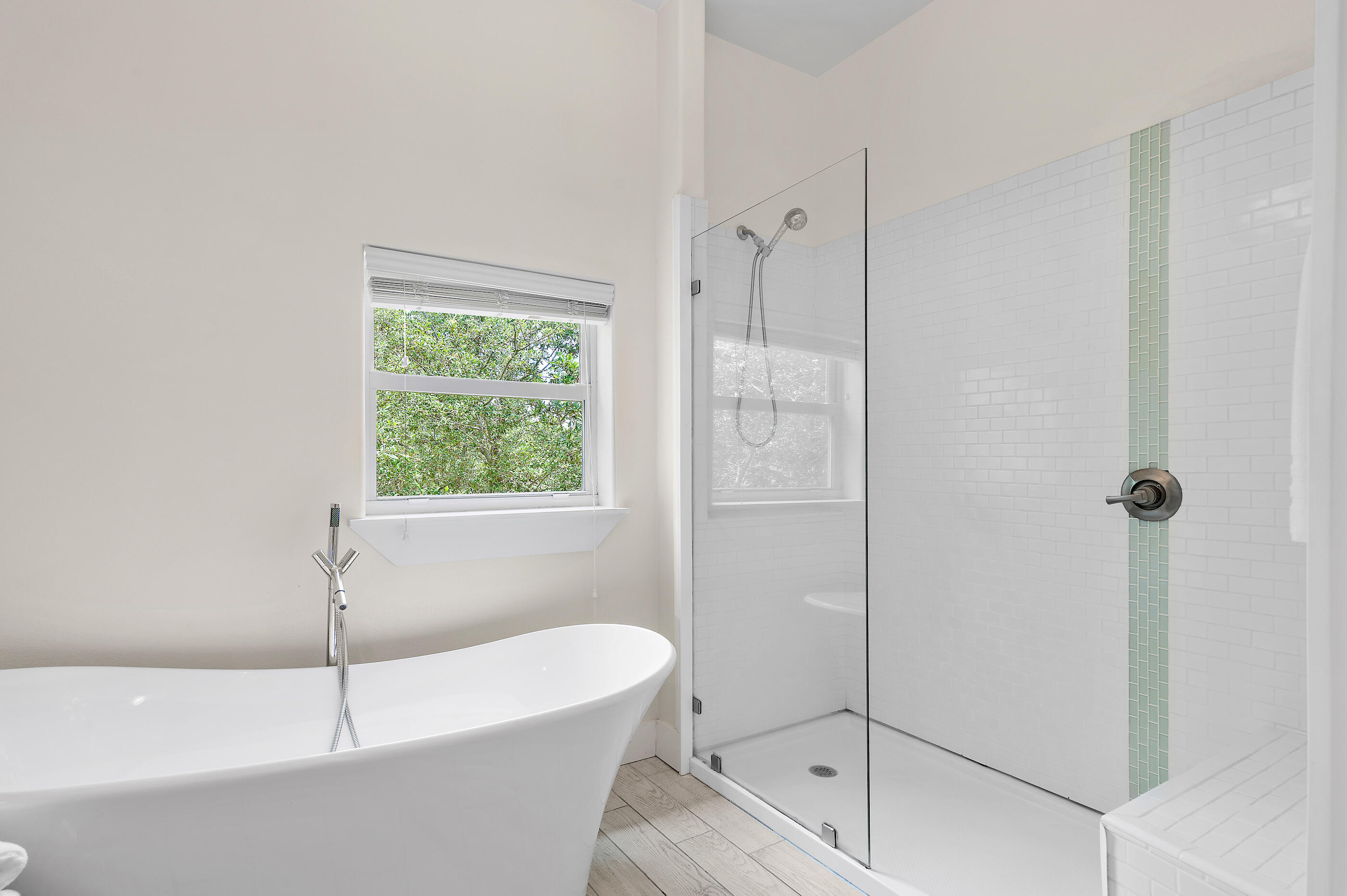 96 Hilltop Drive Santa Rosa Beach, FL 32459 - Photo 25 of 50 a bathroom with a white bath tub and a shower