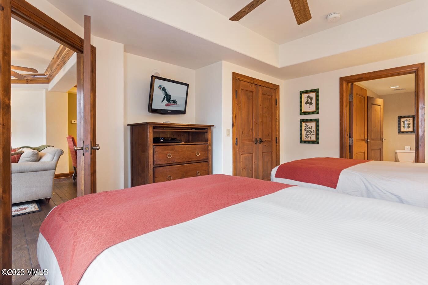 242 East Meadow Drive, Unit 1041 Vail, CO 81657 - Photo 38 of 46 a bedroom with a bed and a chandelier