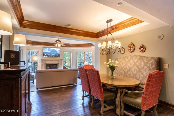 a view of a dining room with furniture and wooden floor