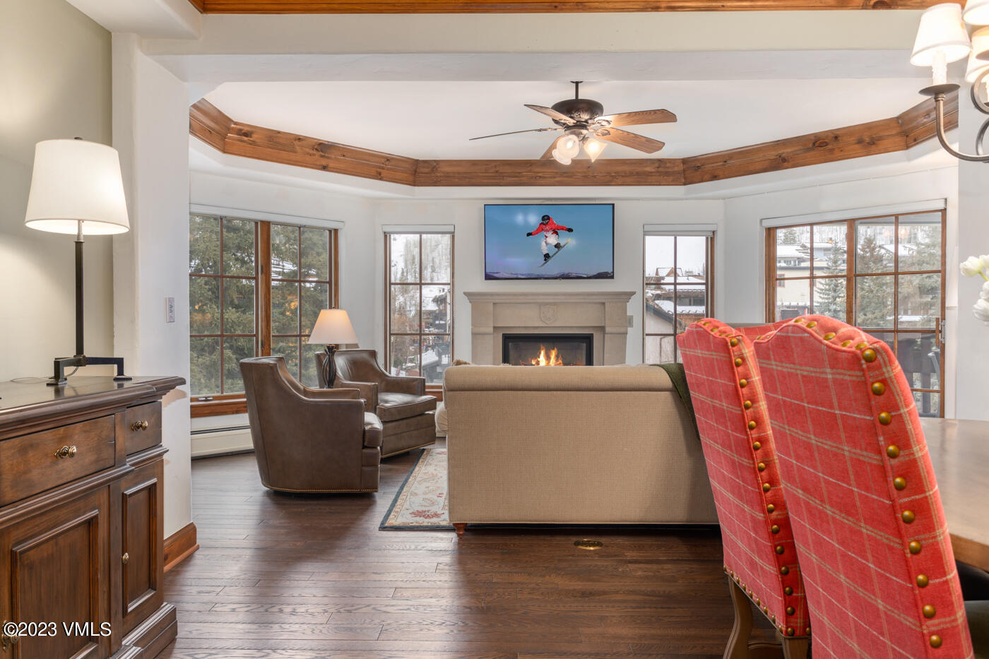 242 East Meadow Drive, Unit 1041 Vail, CO 81657 - Photo 6 of 46 a living room with furniture a fireplace and a flat screen tv