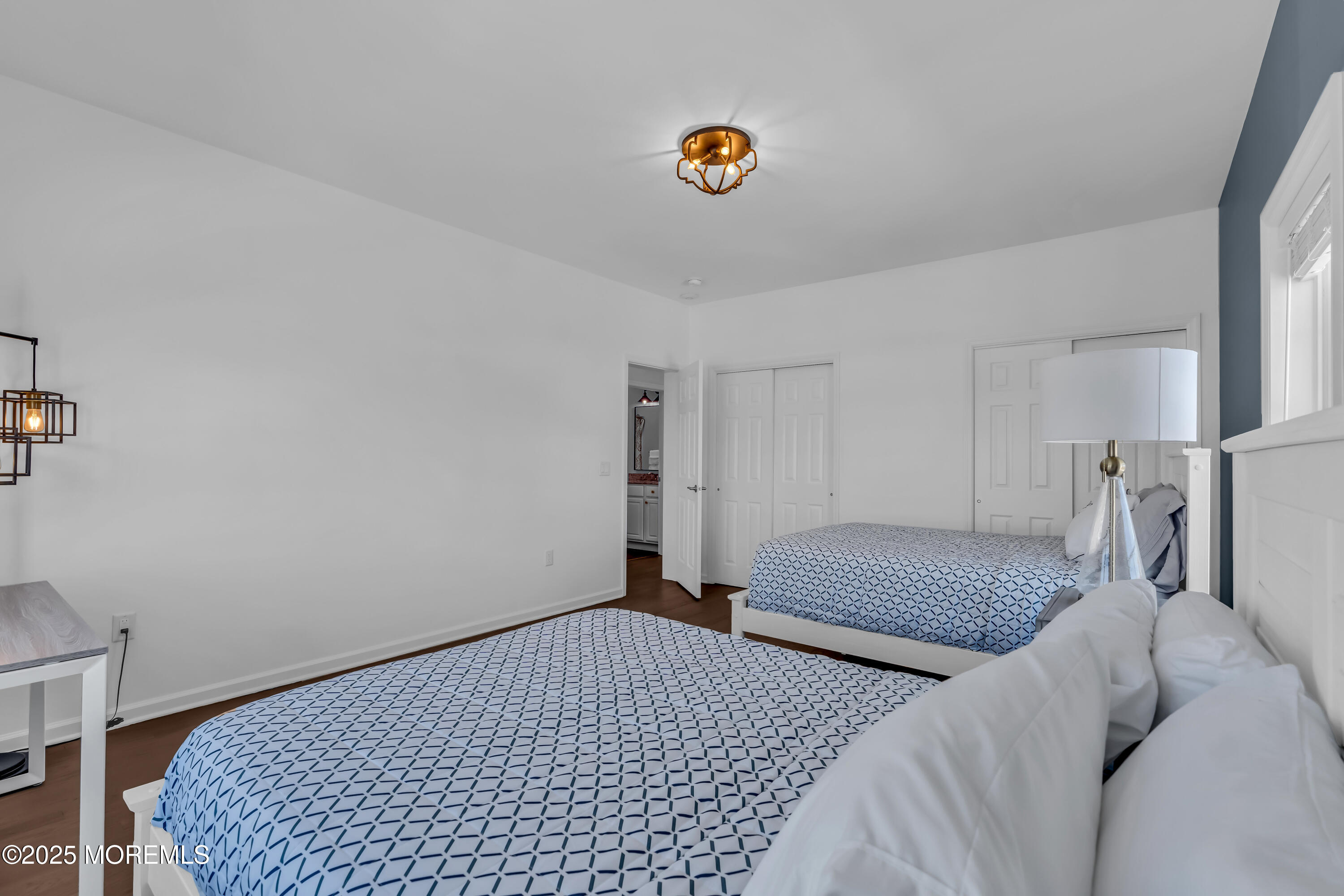 50 Pilot Road Toms River, NJ 08753 - Photo 39 of 73 a bedroom with a bed and a chandelier