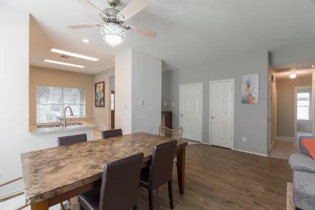 a view of a brick house with a yard