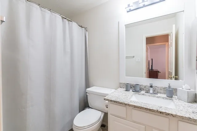 a living room with fireplace furniture and a wooden floor