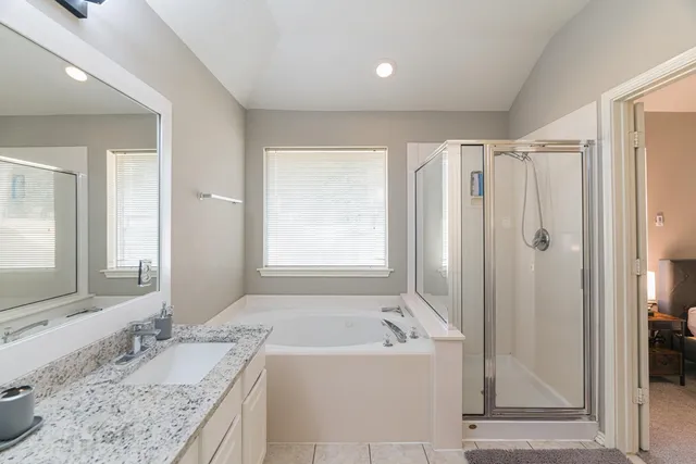 a view of a a dining room with furniture window and wooden floor