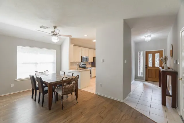 a bedroom with a bed and a chair